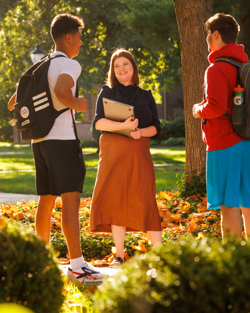 Student Support Services director talks with students