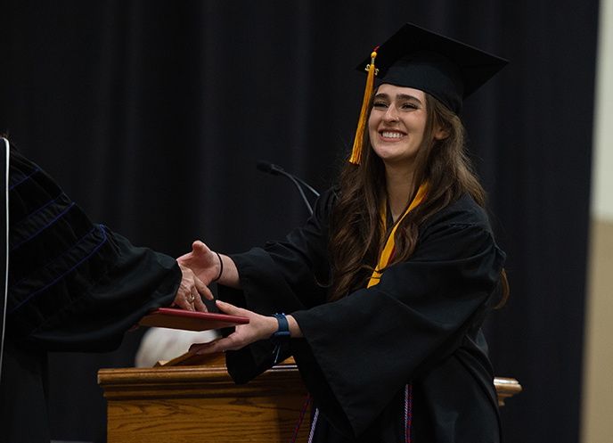 Student receiving diploma