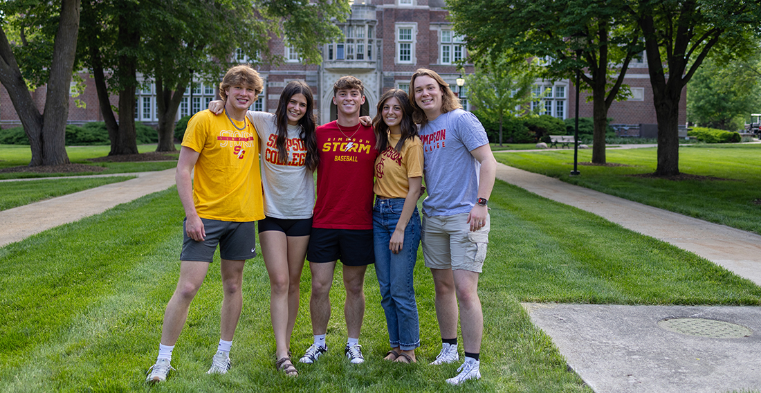 Students by Hillman Hall on Simpson College campus