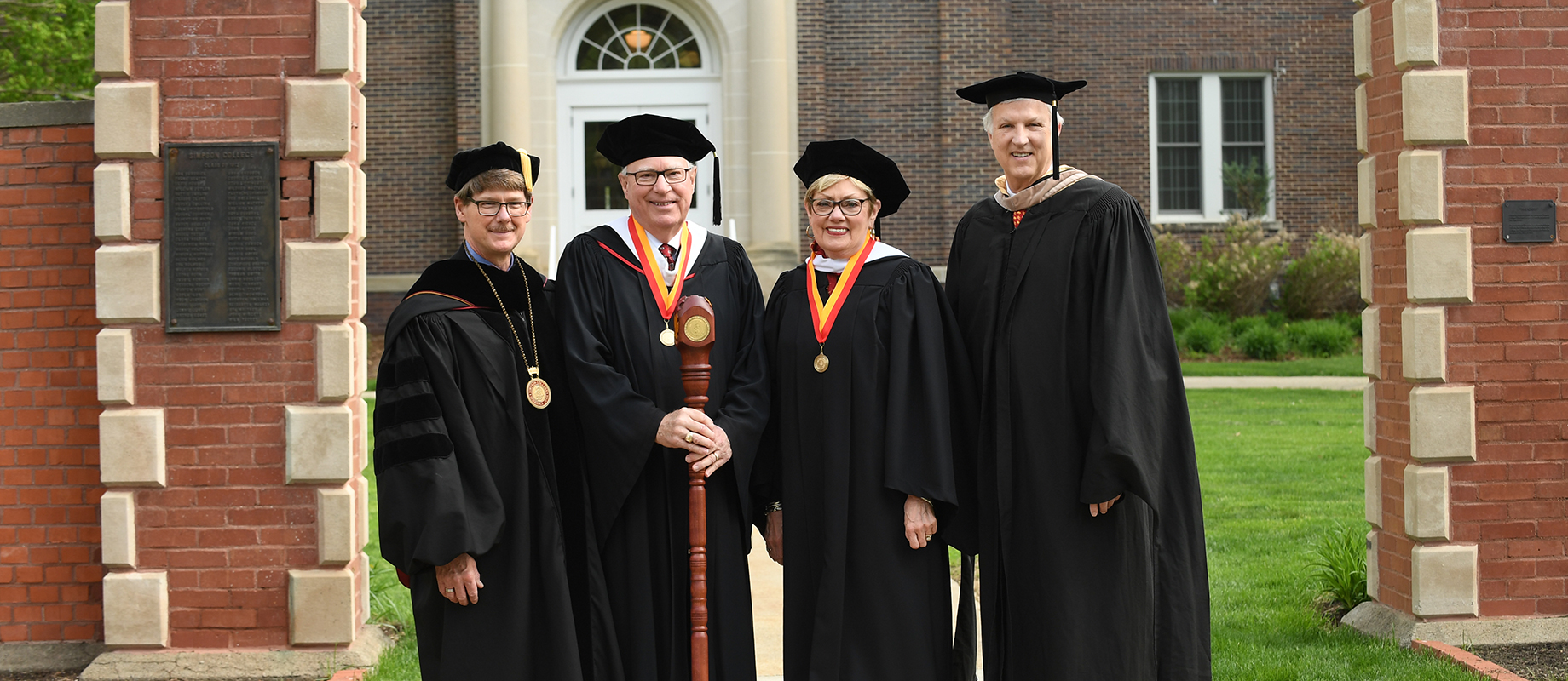 President Jay Simmons (left) poses with Honorary Grand Marshals Chuck '69 and Linda '69 Brice and Board of Trustees Chariman, Terrance Lillis '77.