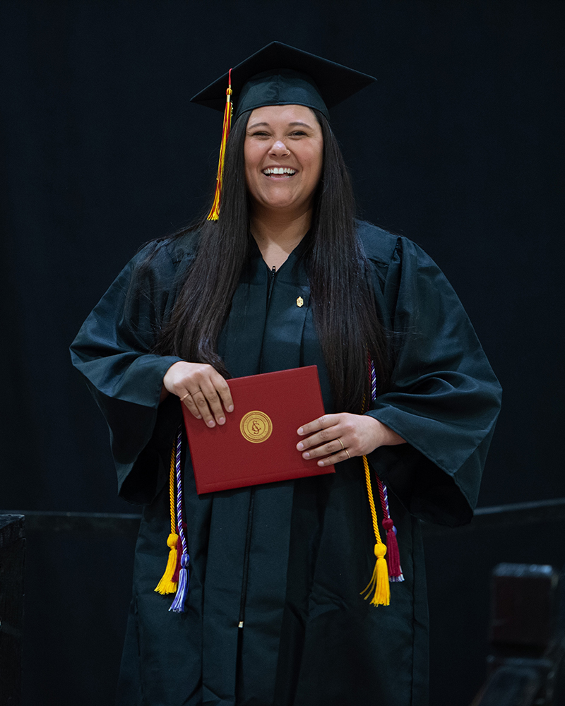 Student getting degree at Commencement