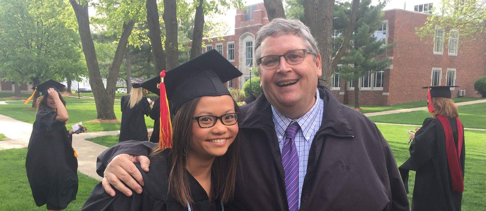 Ken Fuson poses with Steffi Lee '15 following commencement.