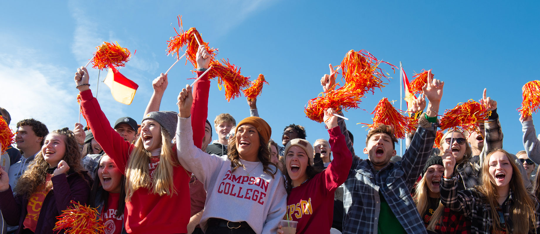 Crowd of students at the Simpson College homecoming football game.
