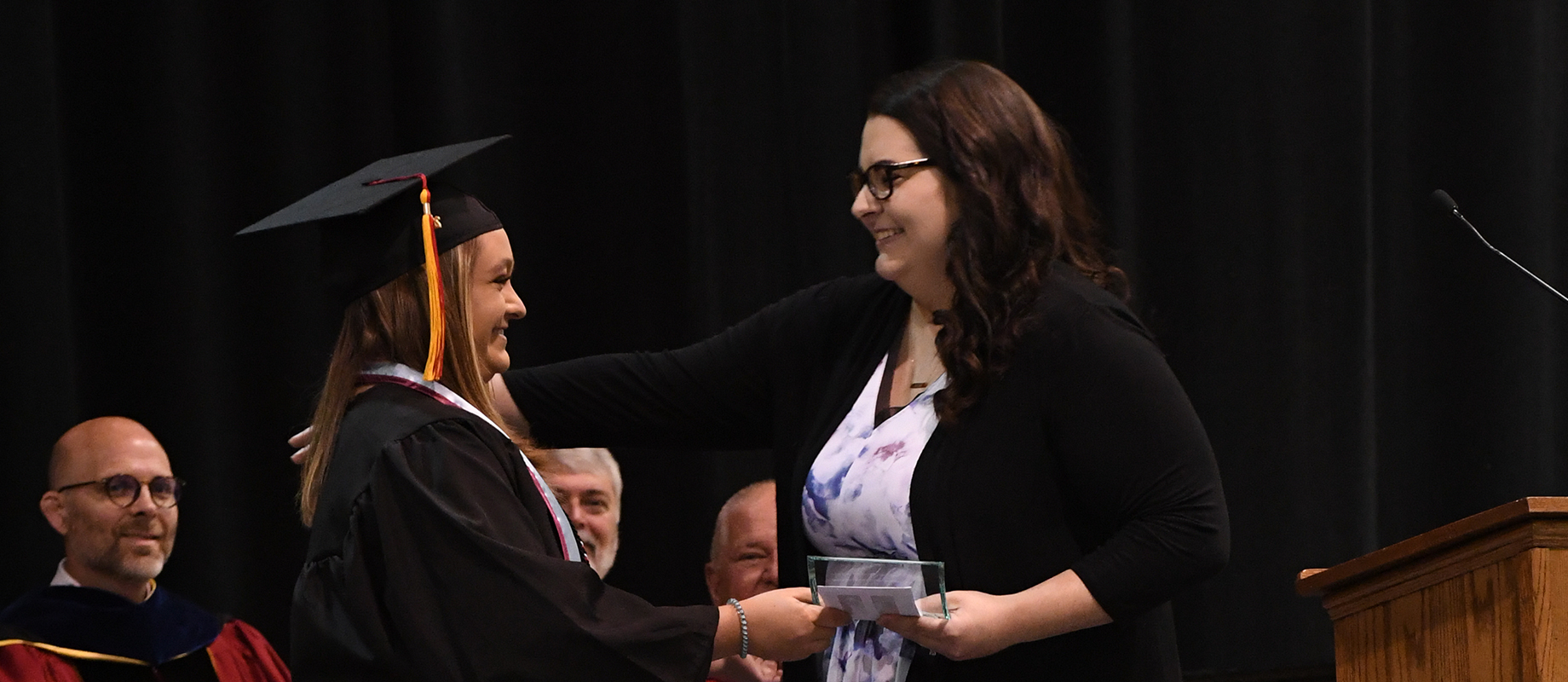 Elyse Morris '11 earned the Staff Student Impact Award at the 2019 commencement ceremony.